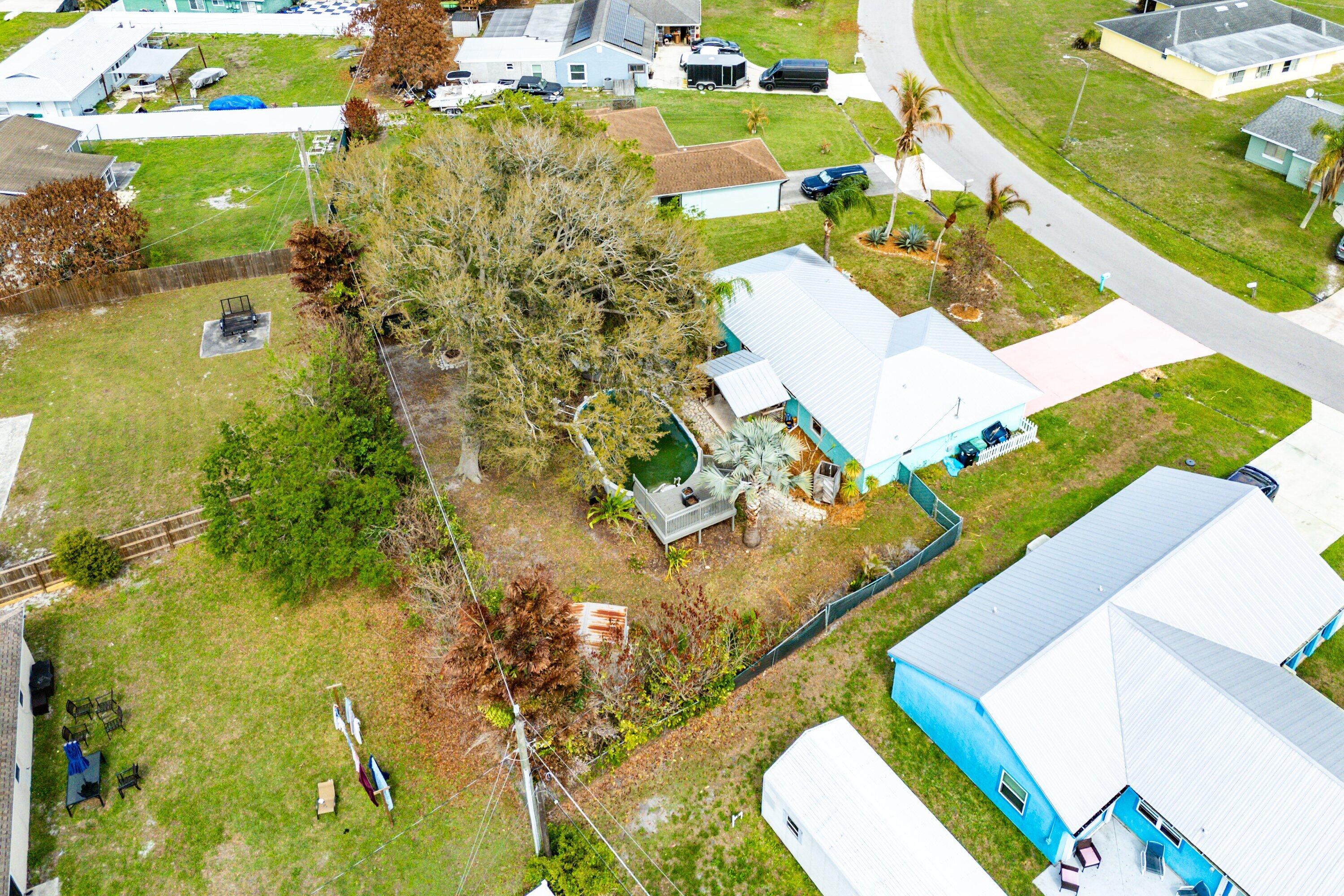 2114 Southeast Midtown Road Port St. Lucie, FL 34952 - Photo 37 of 41 an aerial view of residential houses with outdoor space