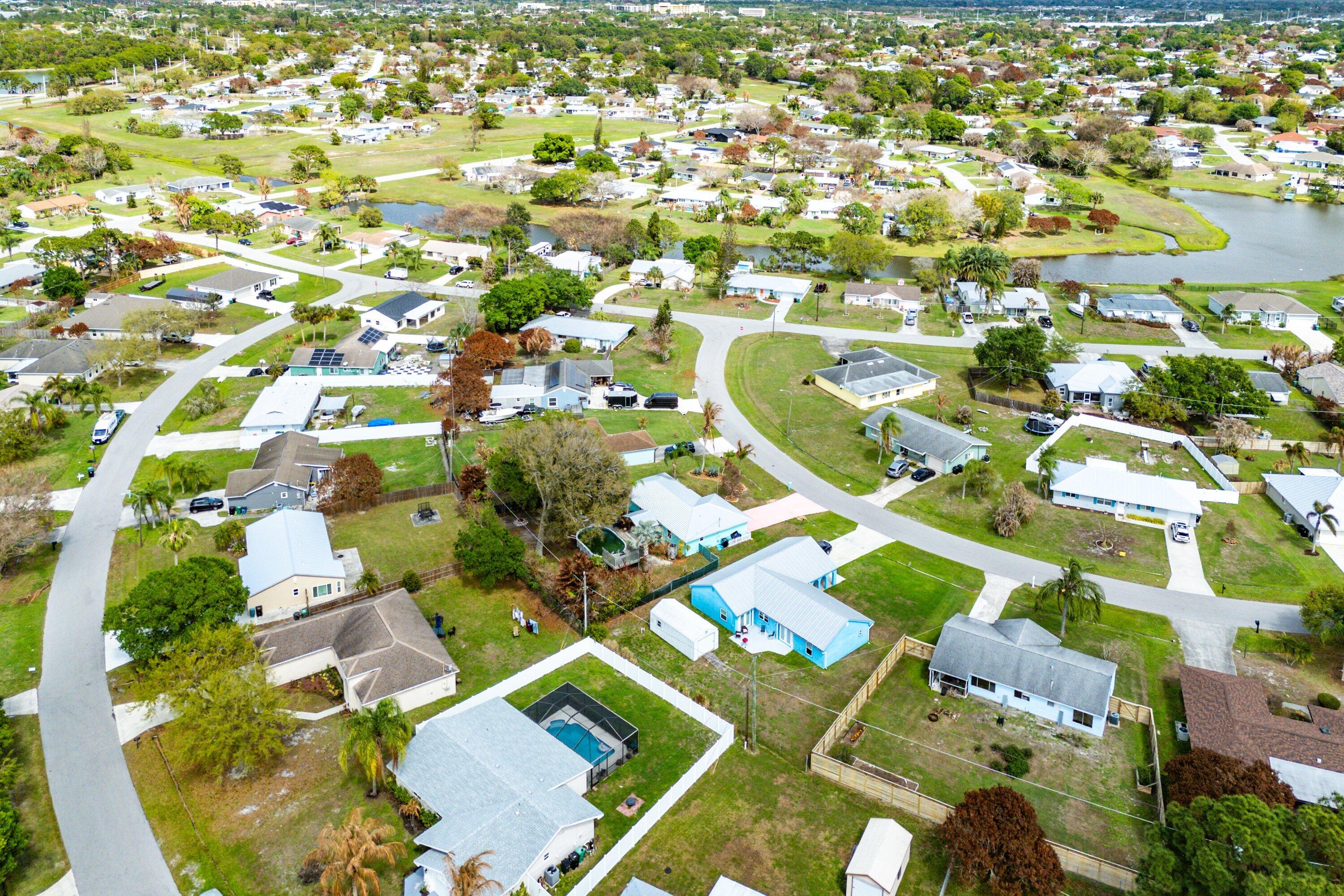 2114 Southeast Midtown Road Port St. Lucie, FL 34952 - Photo 39 of 41 an aerial view of residential houses with outdoor space