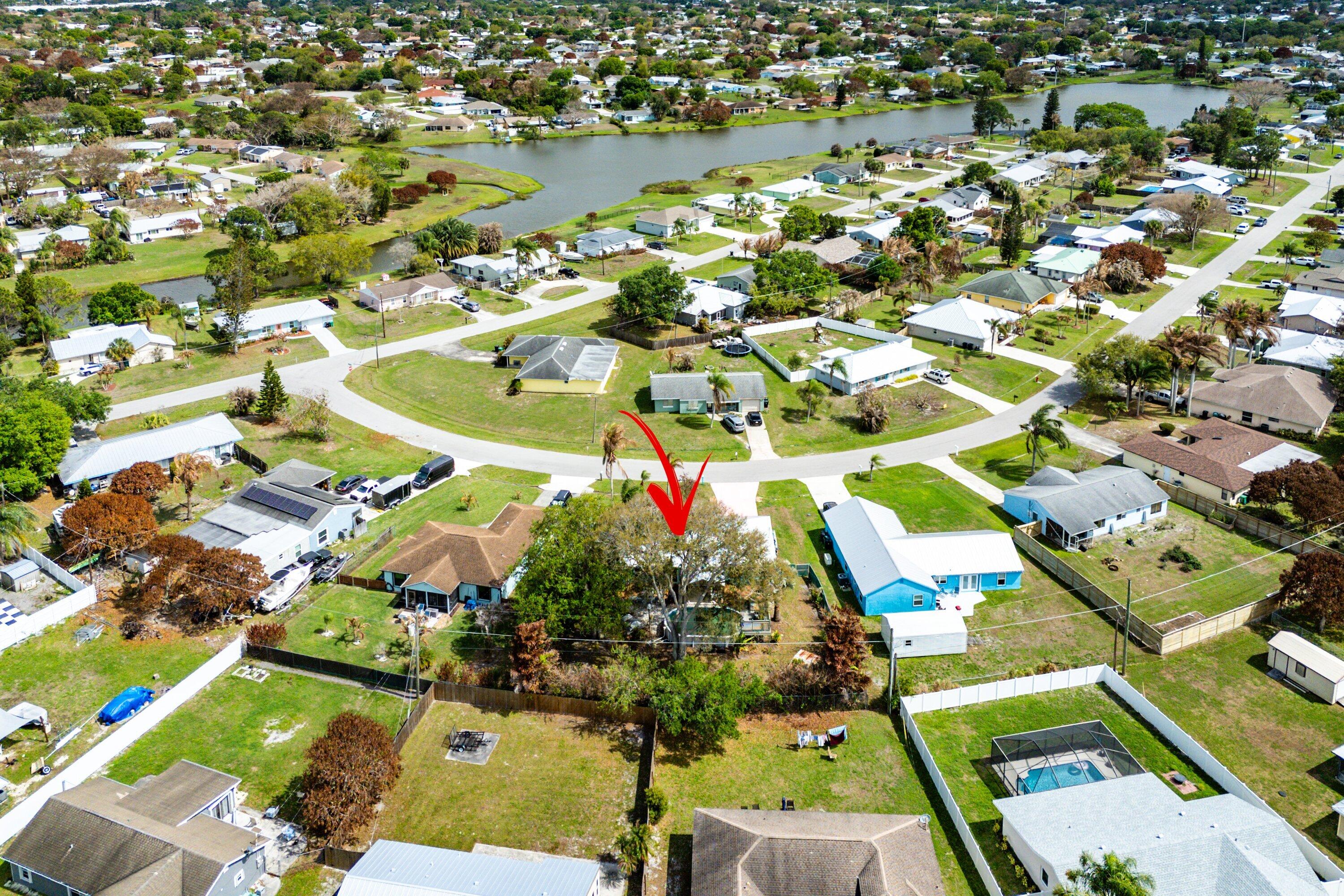 2114 Southeast Midtown Road Port St. Lucie, FL 34952 - Photo 40 of 41 an aerial view of residential houses with outdoor space