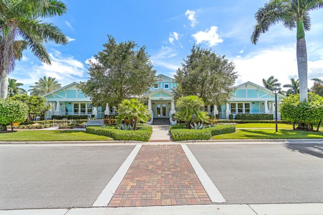 a view of house with outdoor space and swimming pool