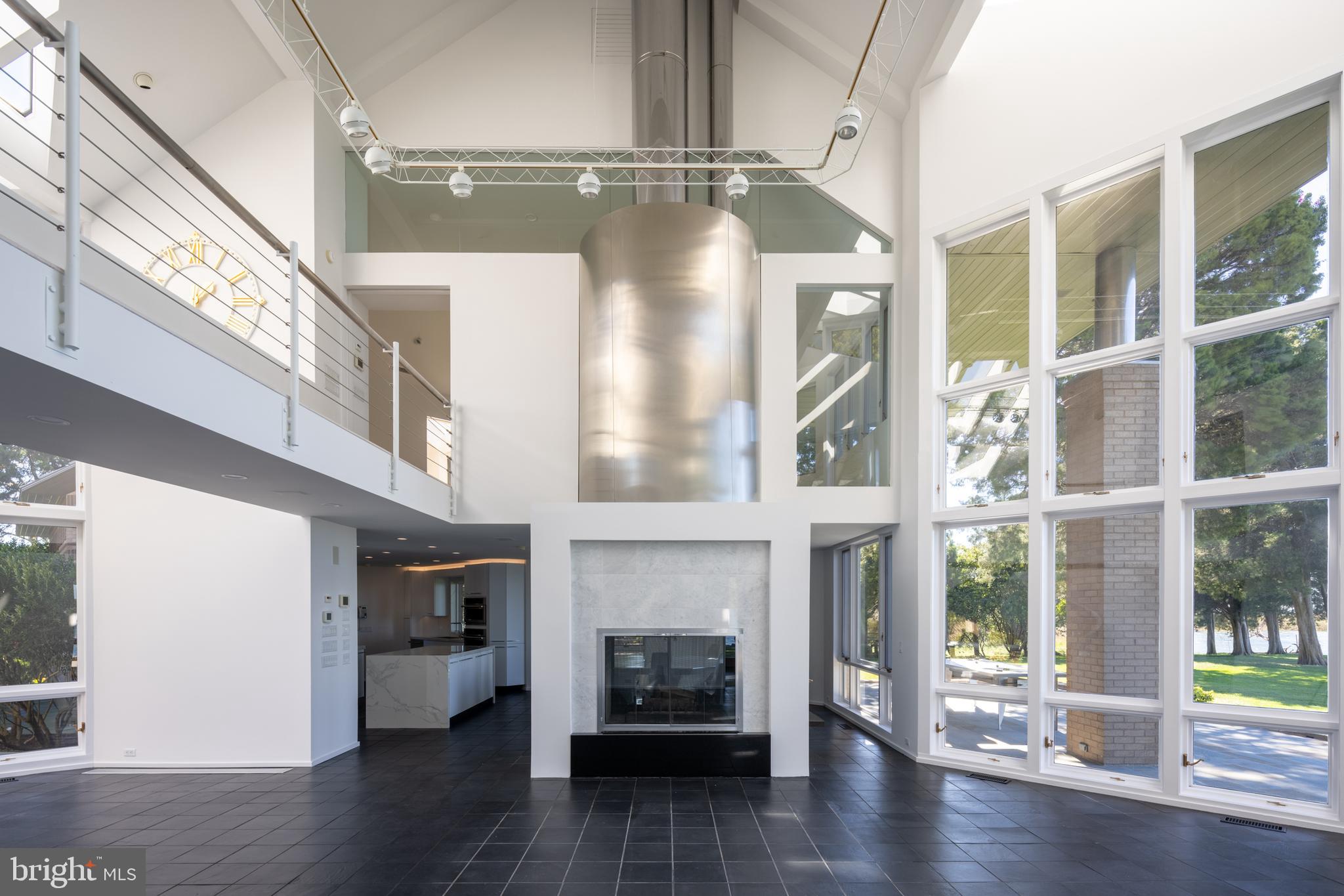 5084 Ferry Neck Road Royal Oak, MD 21662 - Photo 12 of 58 a view of an empty room with wooden floor and a window