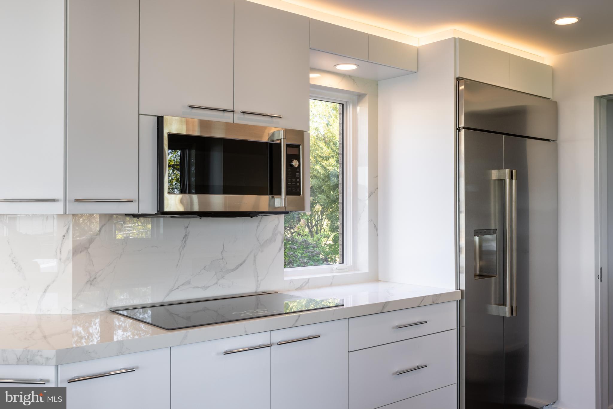 5084 Ferry Neck Road Royal Oak, MD 21662 - Photo 17 of 58 a kitchen with stainless steel appliances granite countertop a sink and a microwave