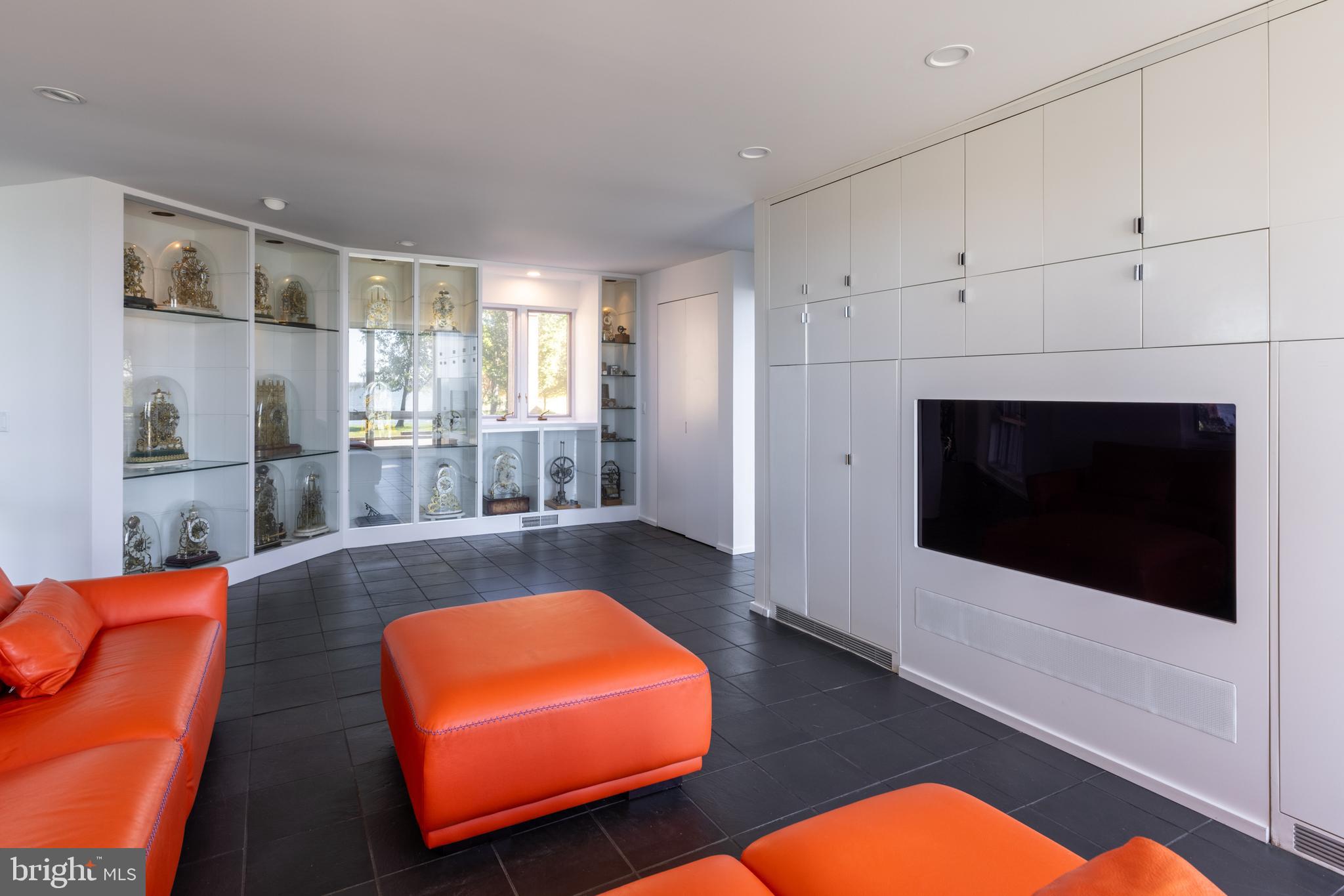 5084 Ferry Neck Road Royal Oak, MD 21662 - Photo 21 of 58 a living room with a flat screen tv