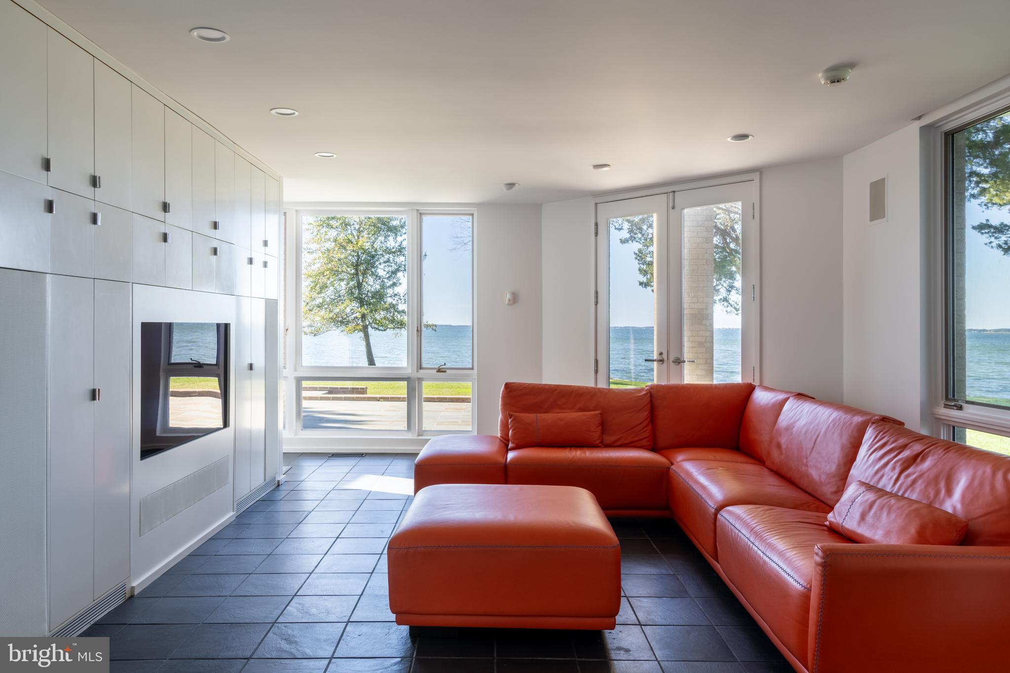 5084 Ferry Neck Road Royal Oak, MD 21662 - Photo 22 of 58 a living room with furniture and a large window