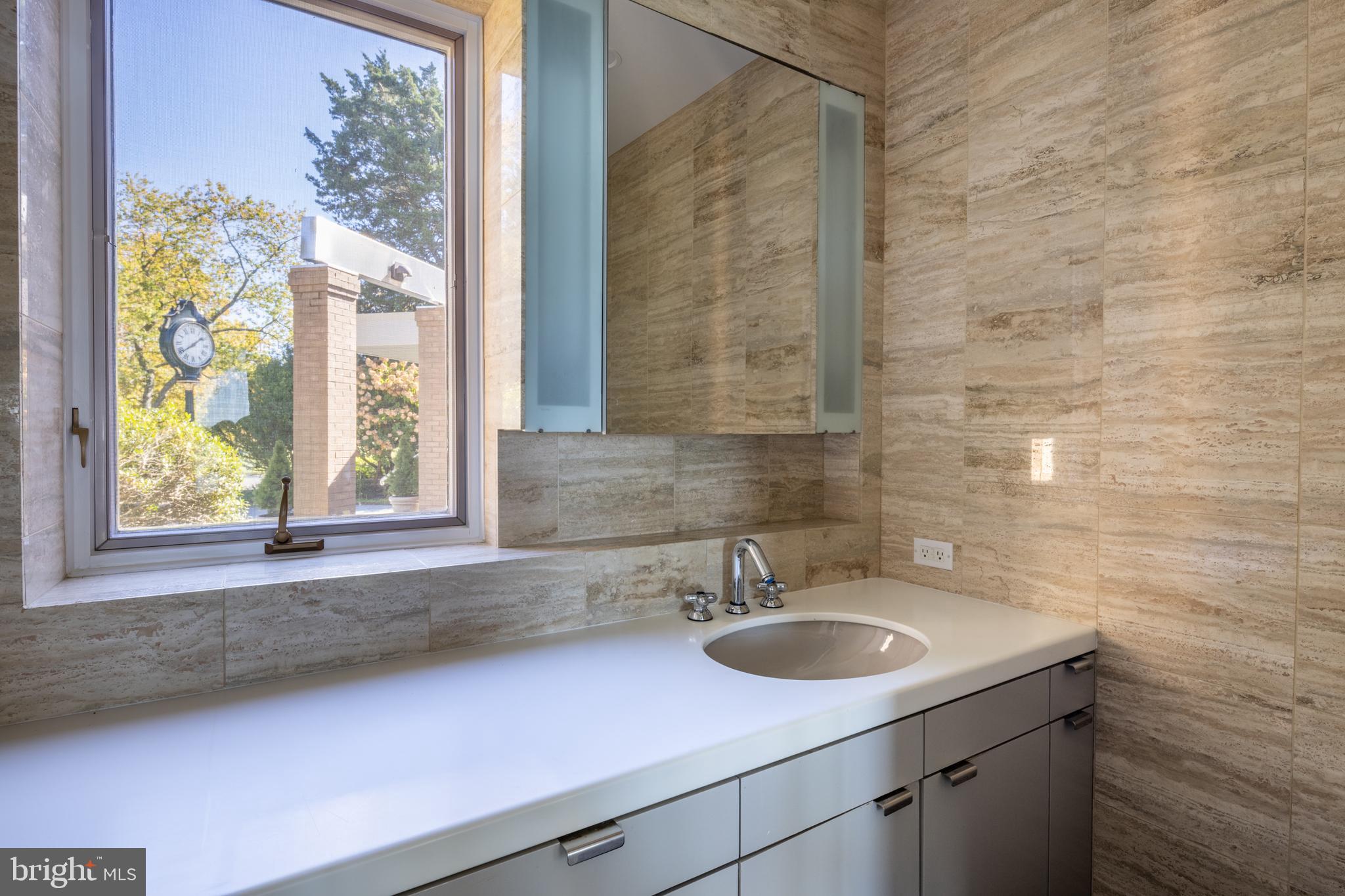 5084 Ferry Neck Road Royal Oak, MD 21662 - Photo 26 of 58 a bathroom with a sink and a window