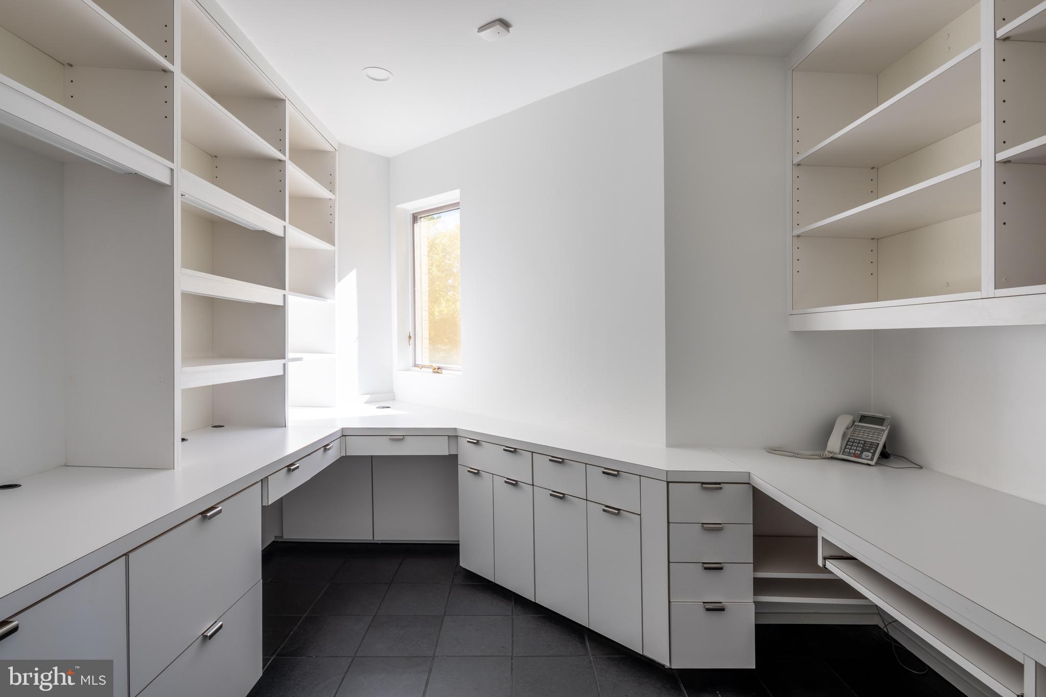 5084 Ferry Neck Road Royal Oak, MD 21662 - Photo 27 of 58 a kitchen with a white cabinets and sink