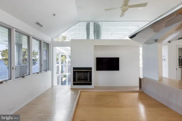 a bathroom with a sink shower and a mirror