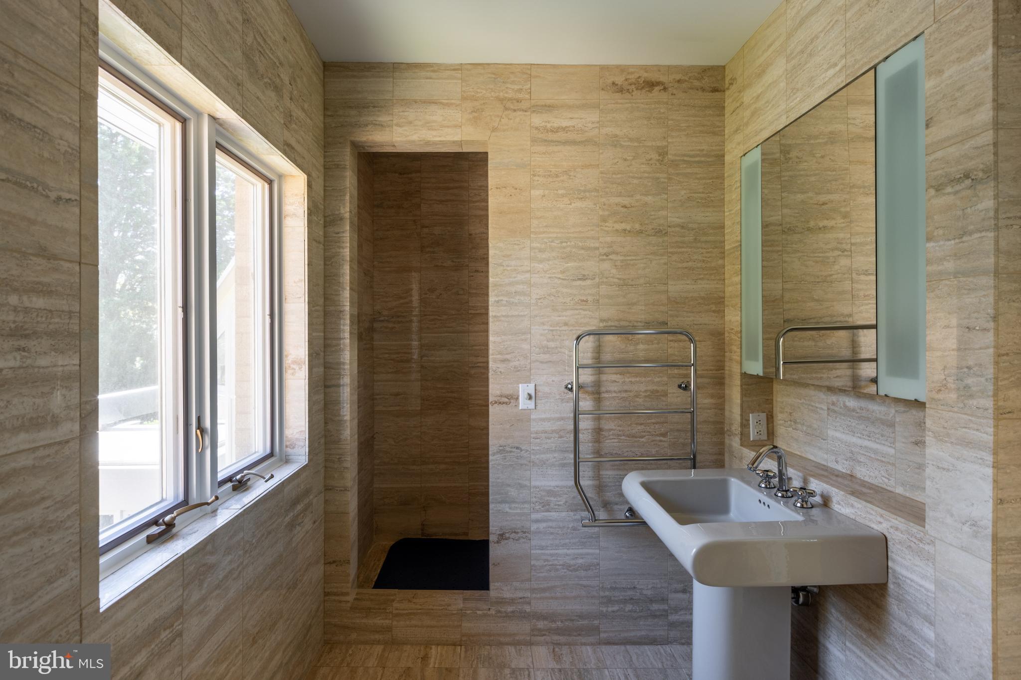 5084 Ferry Neck Road Royal Oak, MD 21662 - Photo 43 of 58 a bathroom with a sink and a mirror