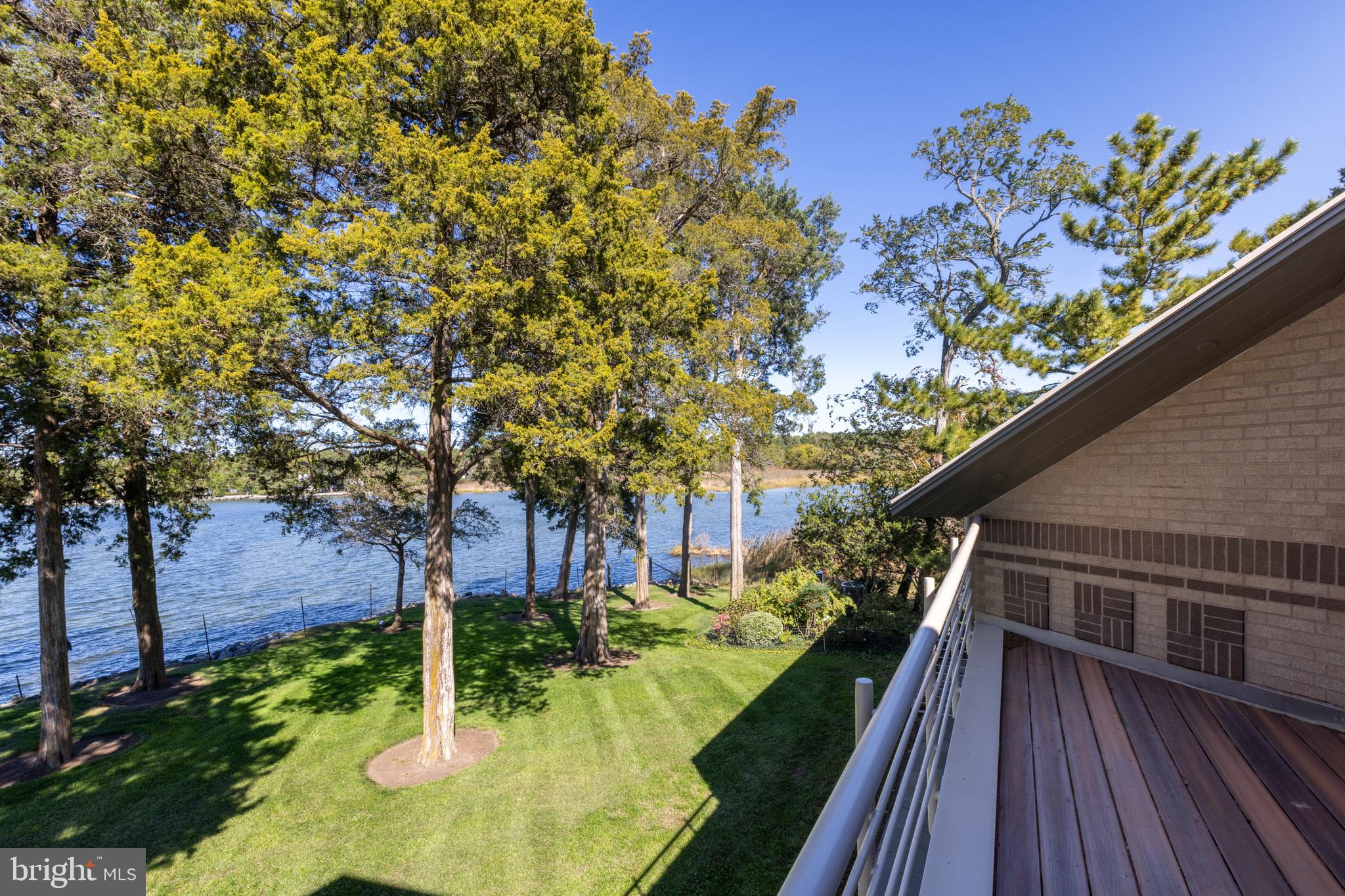 5084 Ferry Neck Road Royal Oak, MD 21662 - Photo 44 of 58 a backyard of a house with lots of green space