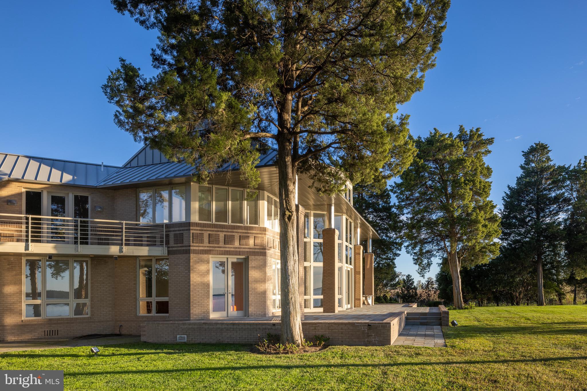 5084 Ferry Neck Road Royal Oak, MD 21662 - Photo 8 of 58 a front view of a house with a garden