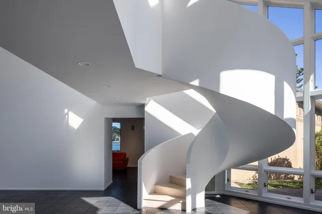 a view of an entryway with wooden floor
