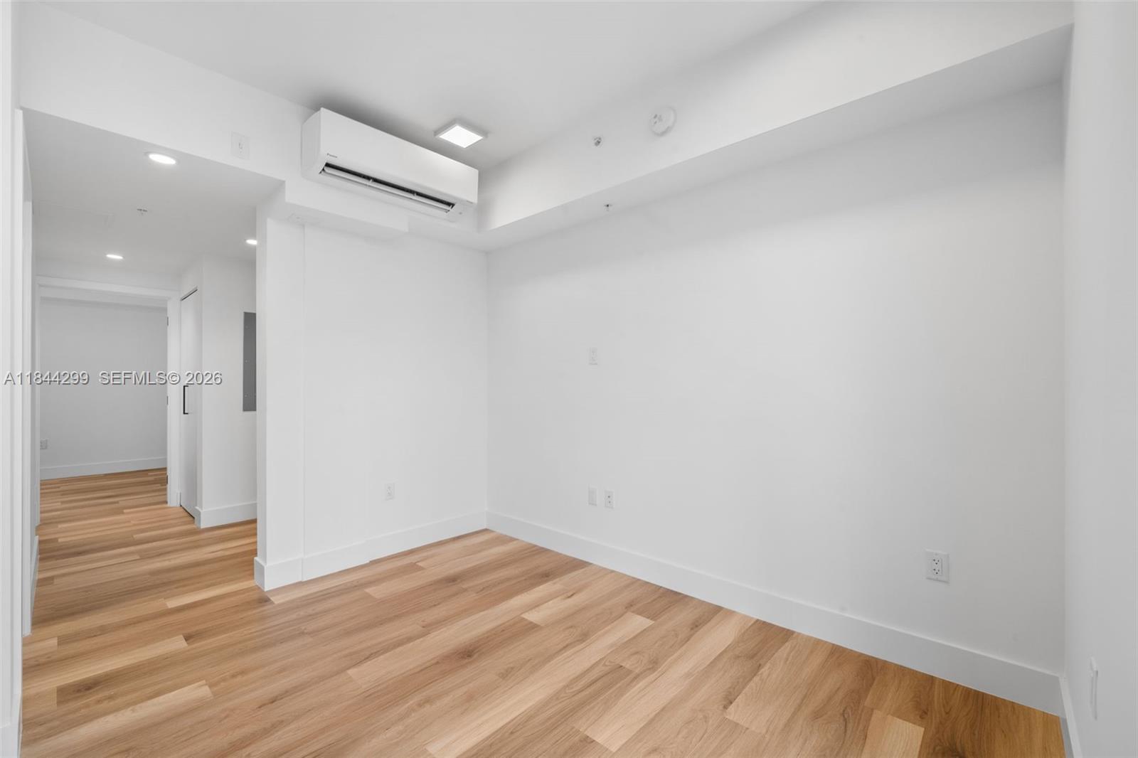 650 Southwest 1st Street, Unit 206 Miami, FL 33130 - Photo 15 of 32 a view of empty room with wooden floor