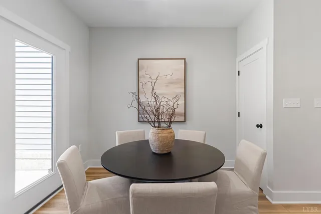 a dining room with furniture and window