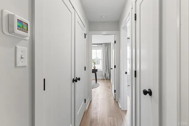a view of a bathroom from a hallway