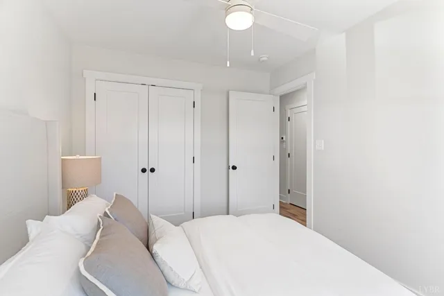 a bedroom with a bed and white walls