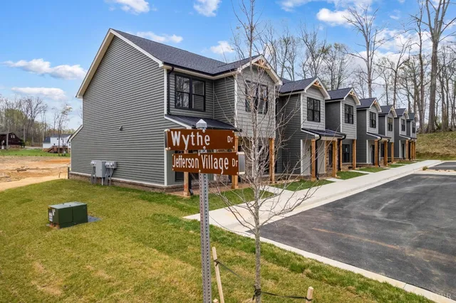 a view of a brick house with a large windows