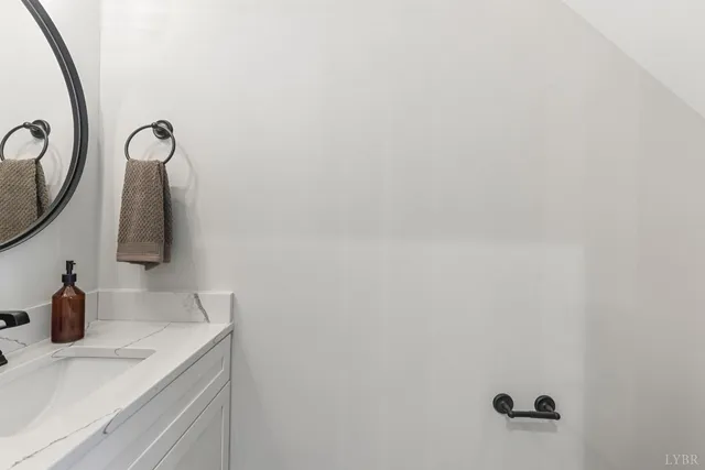 a bathroom with a sink and mirror