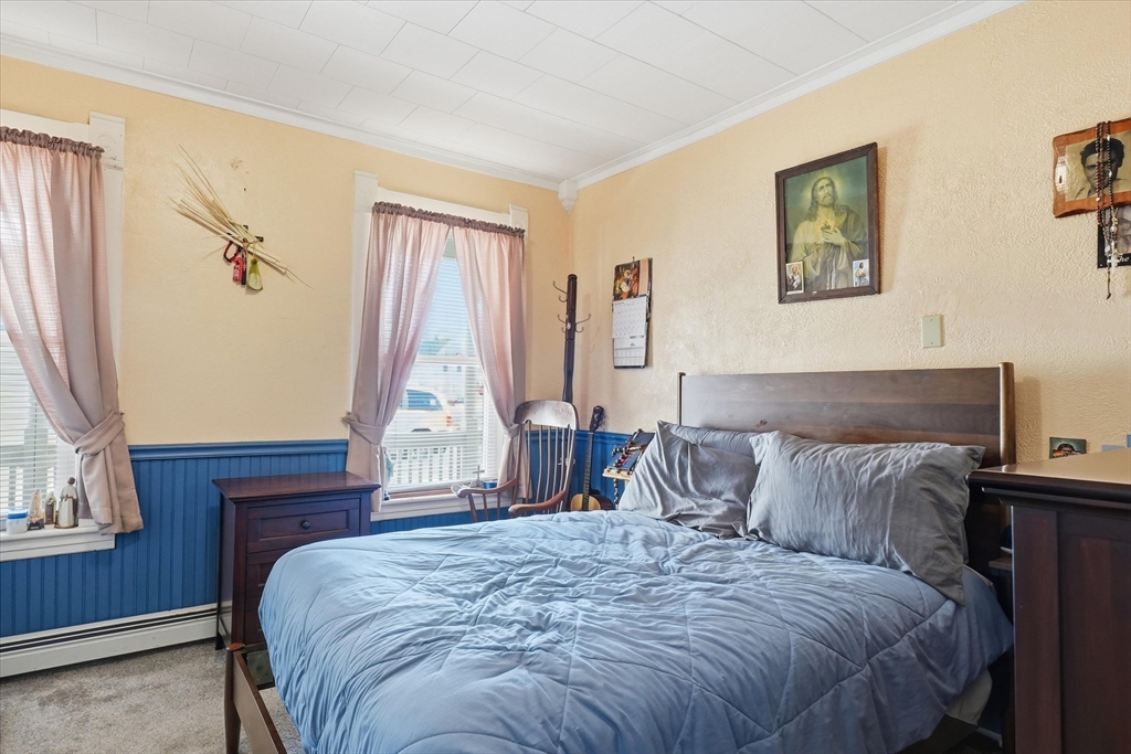 52 Church Street Gardner, MA 01440 - Photo 12 of 36 a bedroom with a bed and a window