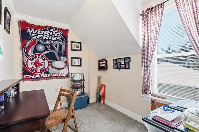 a view of a room with furniture and window