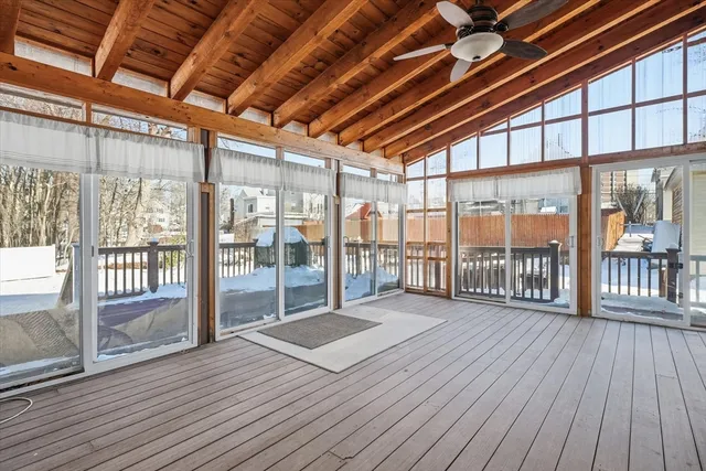 a view of a balcony with wooden floor