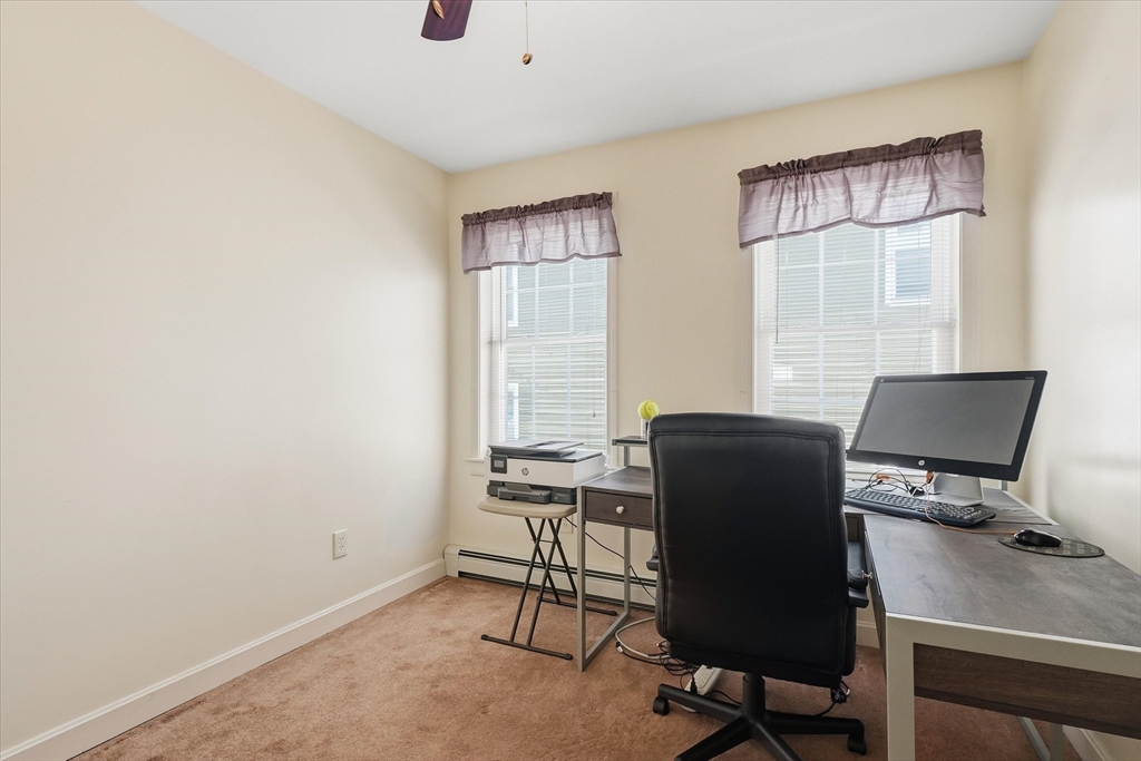 52 Church Street Gardner, MA 01440 - Photo 23 of 36 a view of a workspace with furniture and a window