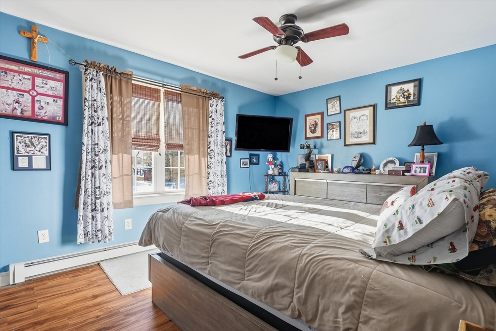 52 Church Street Gardner, MA 01440 - Photo 24 of 36 a bedroom with a bed and a flat screen tv