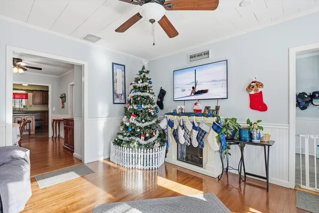 a view of a entryway dining room and hall with wooden floor