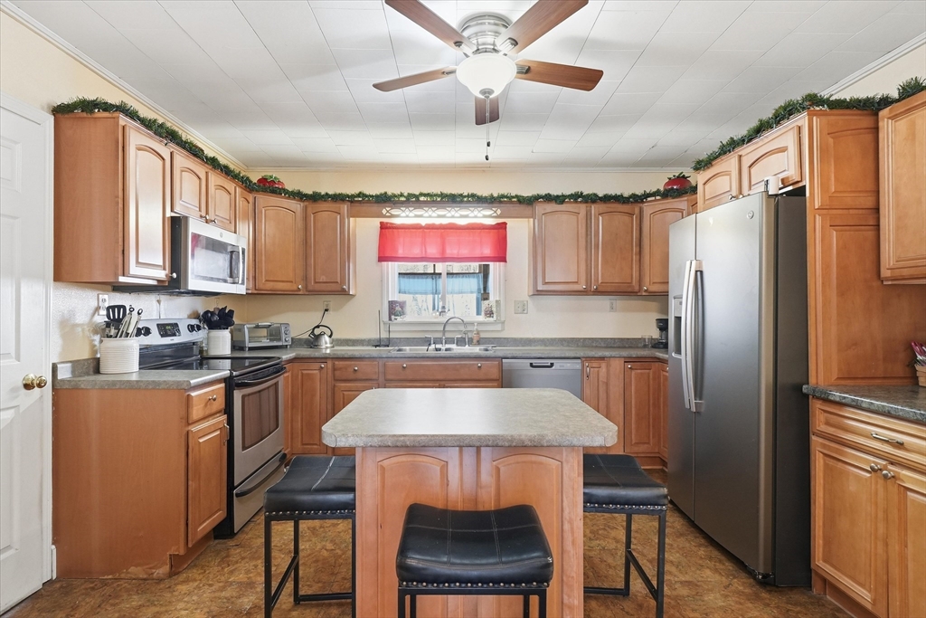 52 Church Street Gardner, MA 01440 - Photo 7 of 36 a kitchen with stainless steel appliances granite countertop a stove a refrigerator and a sink