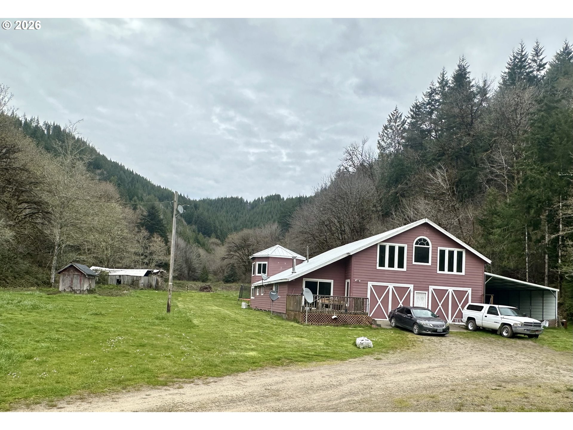 1910 Otter Slough Road Reedsport, OR 97467 - Photo 1 of 39 a house view with a garden