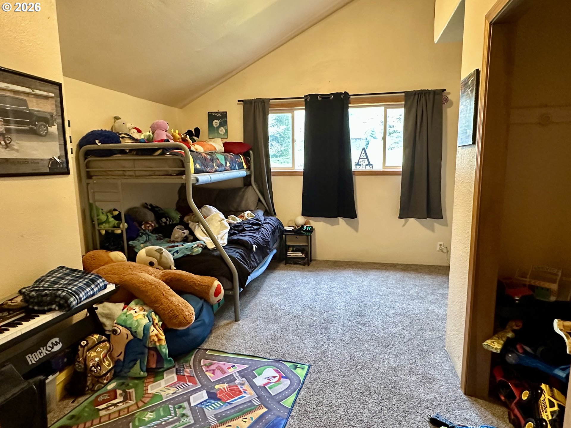 1910 Otter Slough Road Reedsport, OR 97467 - Photo 17 of 39 a bedroom with bed and window