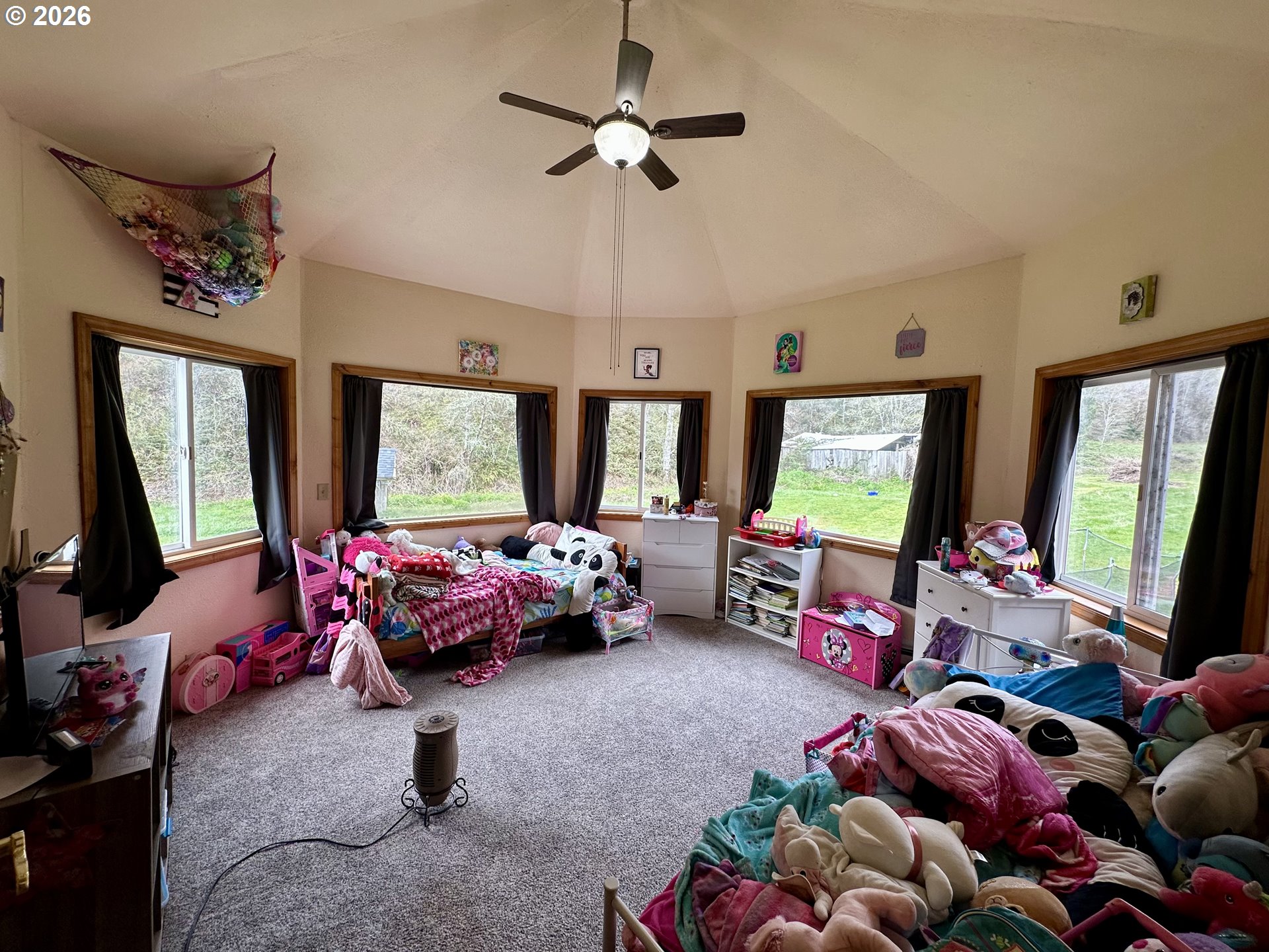 1910 Otter Slough Road Reedsport, OR 97467 - Photo 19 of 39 a living room with furniture and a flat screen tv