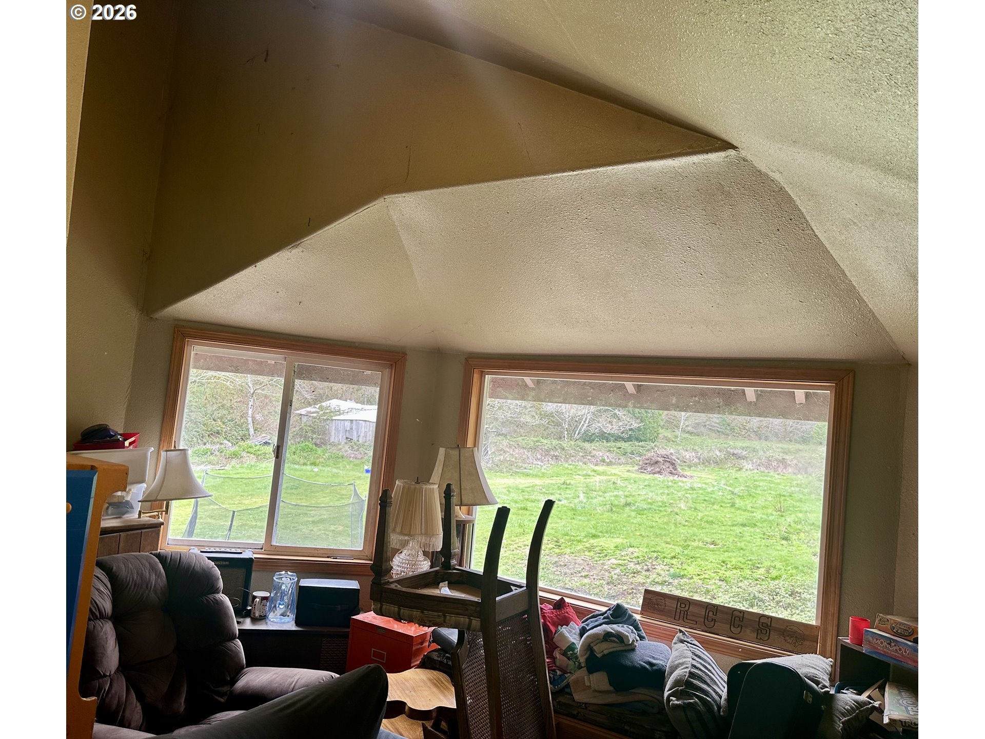 1910 Otter Slough Road Reedsport, OR 97467 - Photo 22 of 39 a very nice looking room with a large window