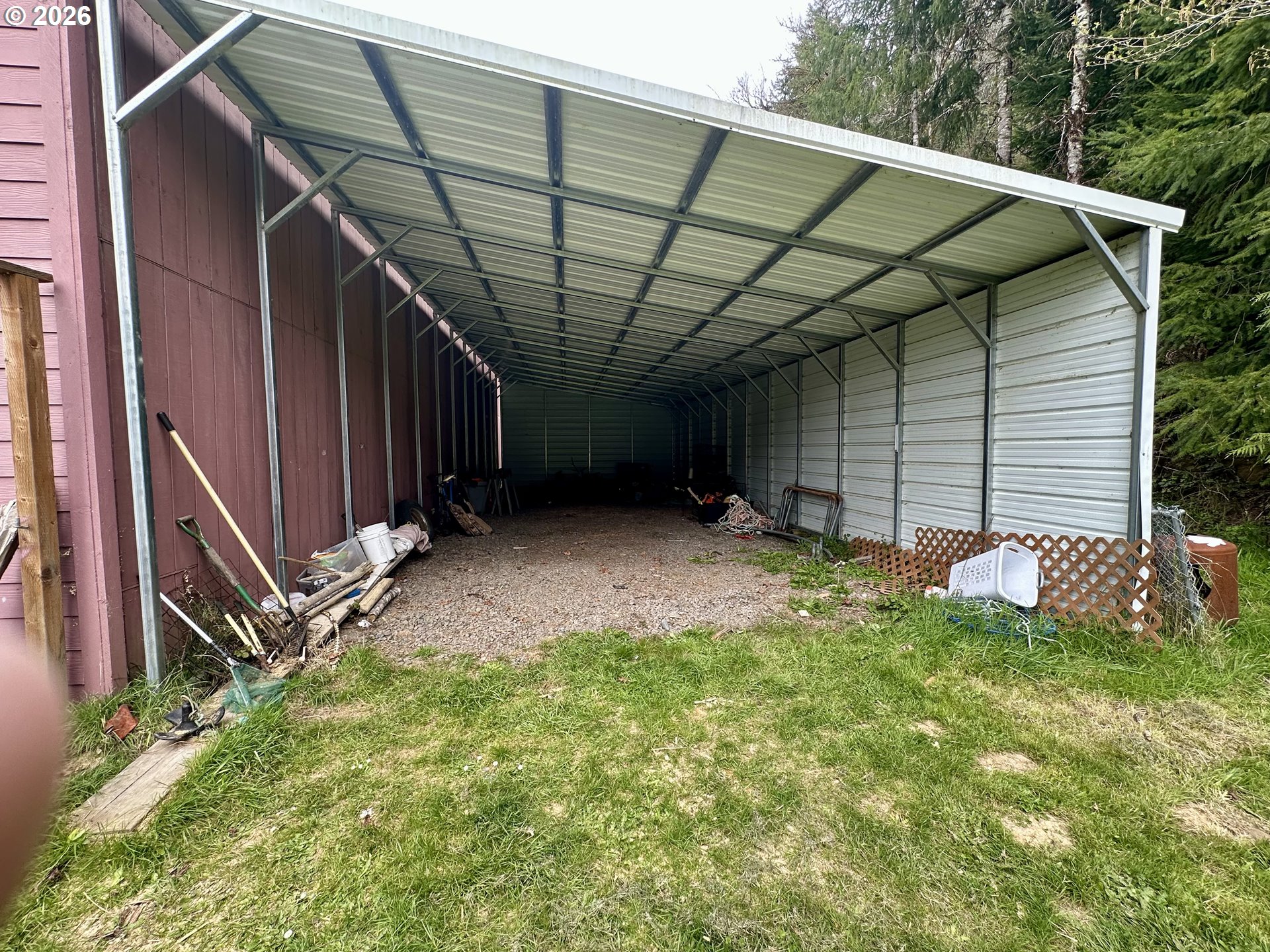 1910 Otter Slough Road Reedsport, OR 97467 - Photo 25 of 39 a backyard of a house with swing and deck