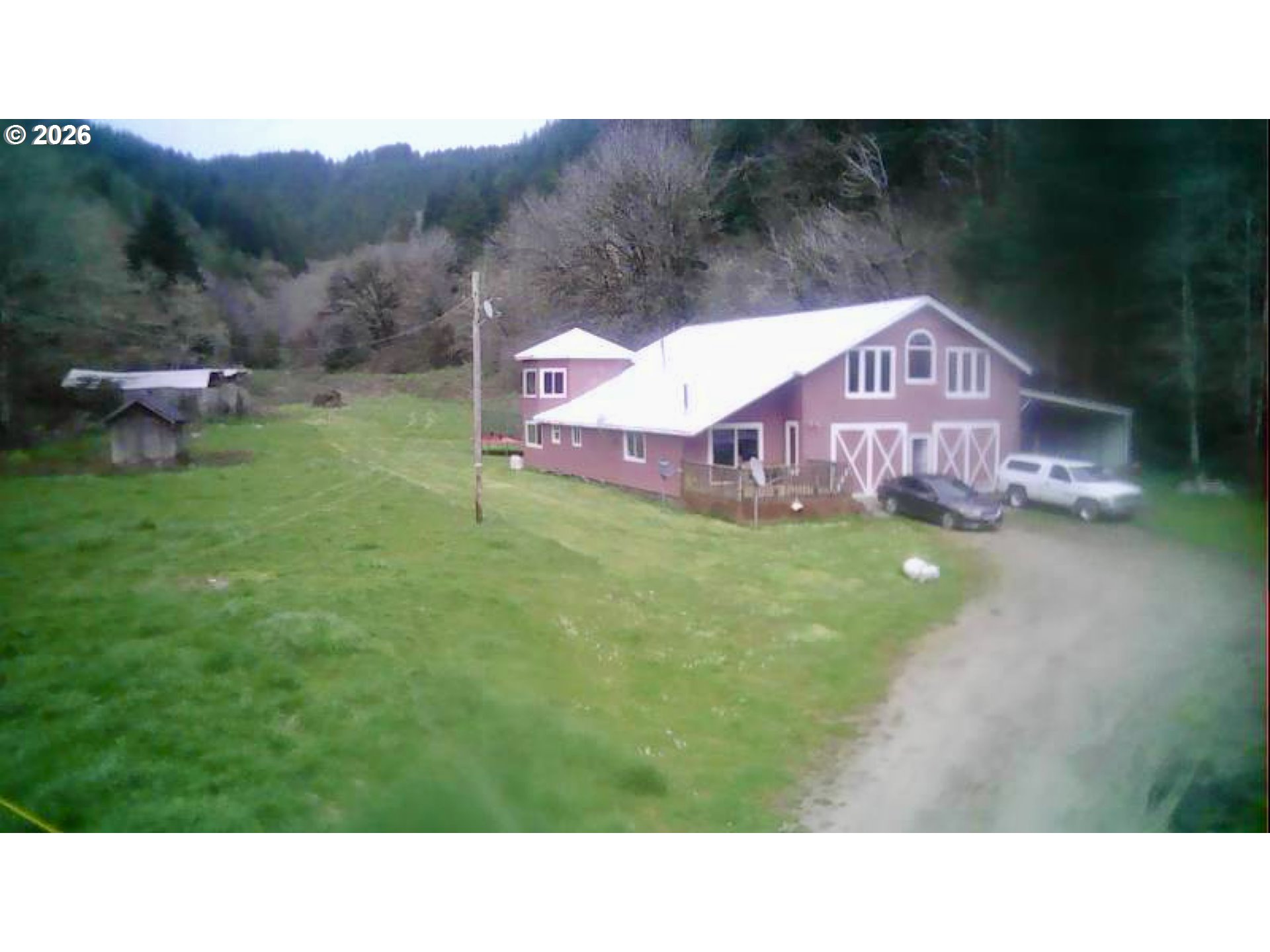 1910 Otter Slough Road Reedsport, OR 97467 - Photo 33 of 39 a backyard of a house with table and chairs