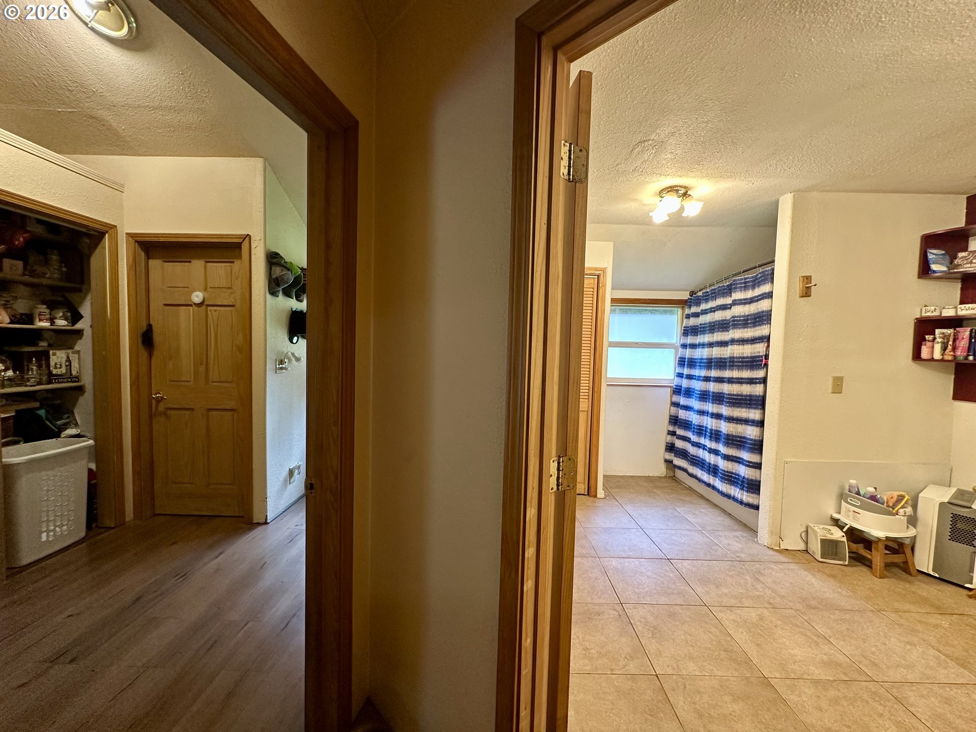 1910 Otter Slough Road Reedsport, OR 97467 - Photo 7 of 39 a view of a hallway with wooden floor and closet