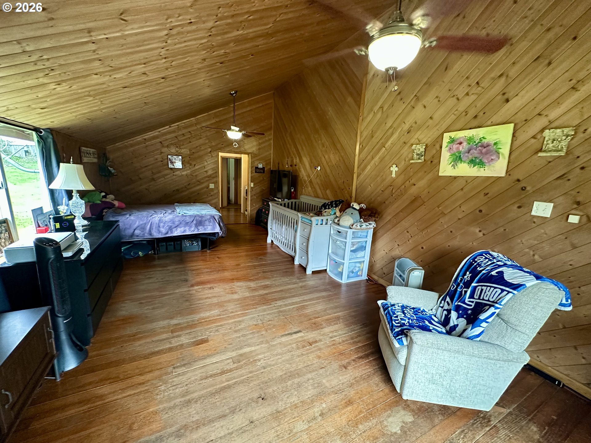 1910 Otter Slough Road Reedsport, OR 97467 - Photo 10 of 39 a living room with furniture and a wooden floor