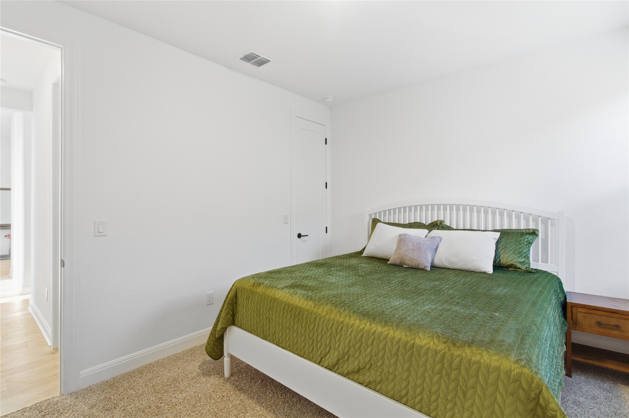 2032 Rushing Ranch Path Georgetown, TX 78628 - Photo 28 of 30 Smooth plaster walls and neutral carpeting define this clean, modern bedroom space.