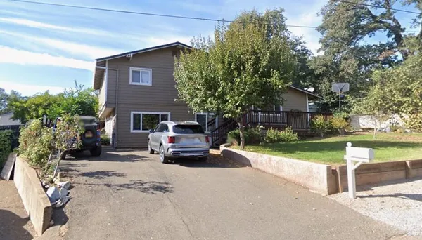 a car parked in front of a house