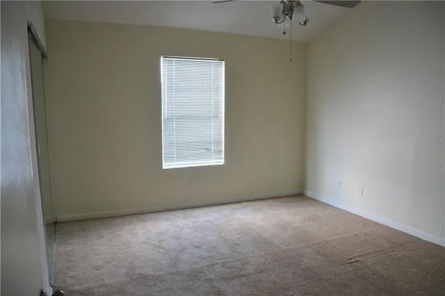 a bathroom with a toilet and a bathtub