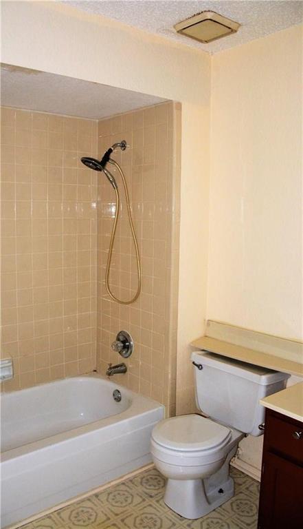 2400 Jupiter Road, Unit A3 Plano, TX 75074 - Photo 12 of 16 a bathroom with a toilet and a bathtub