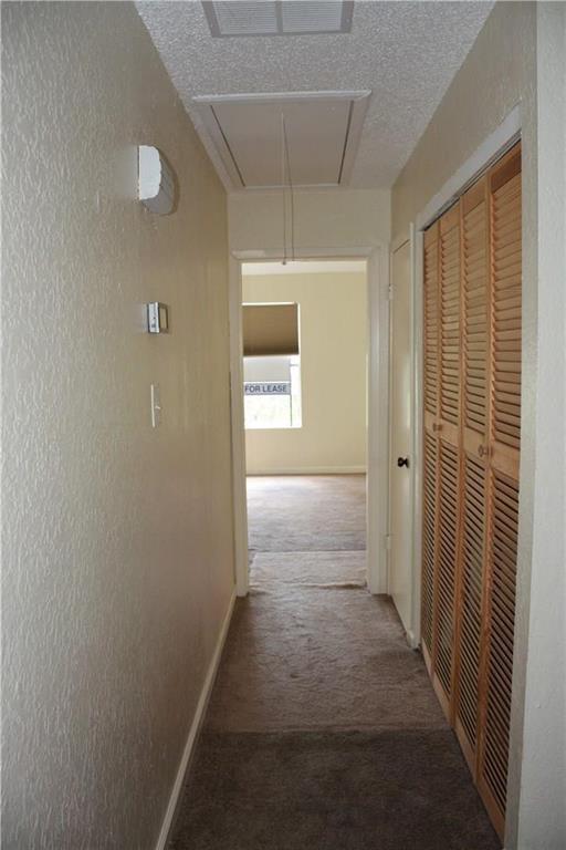2400 Jupiter Road, Unit A3 Plano, TX 75074 - Photo 14 of 16 a view of a hallway