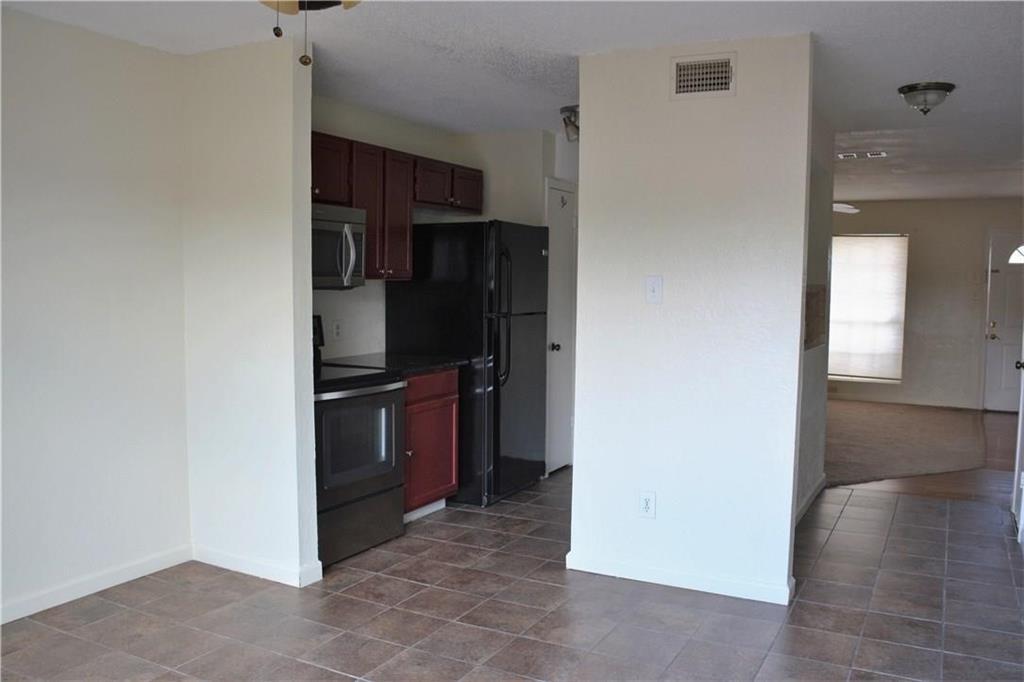 2400 Jupiter Road, Unit A3 Plano, TX 75074 - Photo 6 of 16 a view of a kitchen