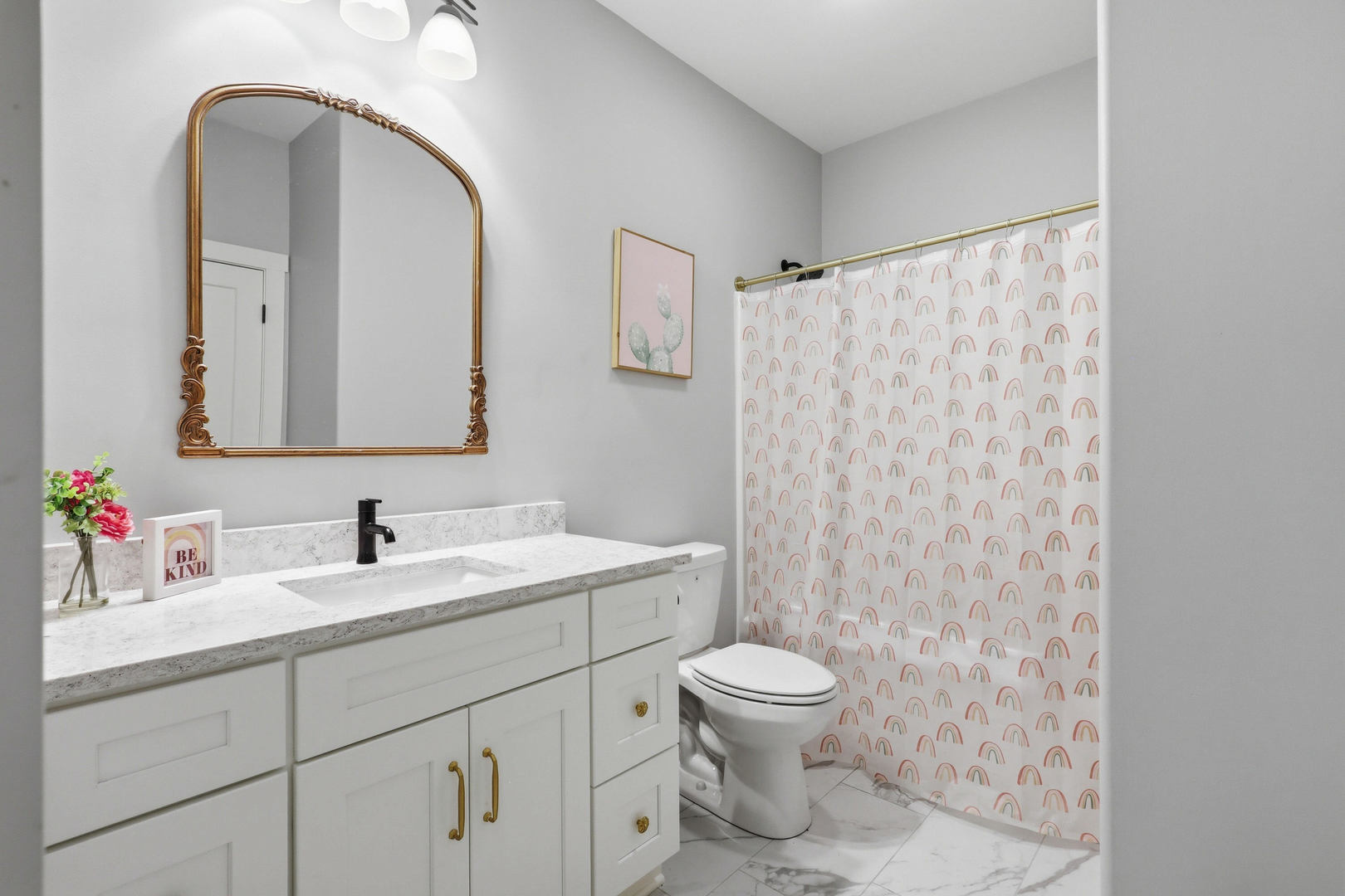 6779 Genesis Way Bettendorf, IA 52722 - Photo 23 of 36 a bathroom with a toilet sink and mirror