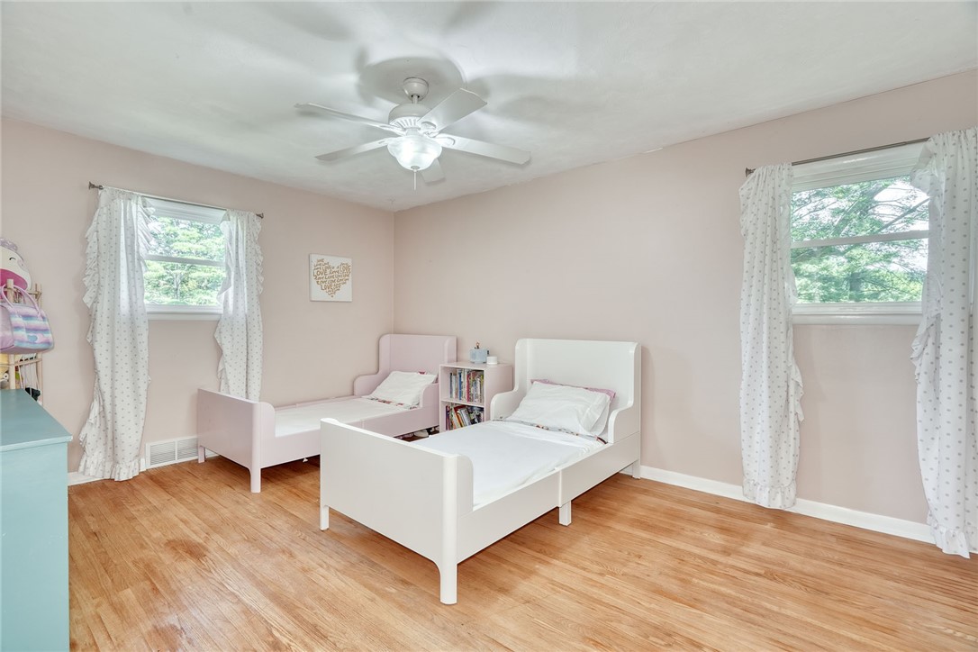 1038 Whalen Road Penfield, NY 14526 - Photo 25 of 46 Bedroom number three with ceiling, fan and hardwoo