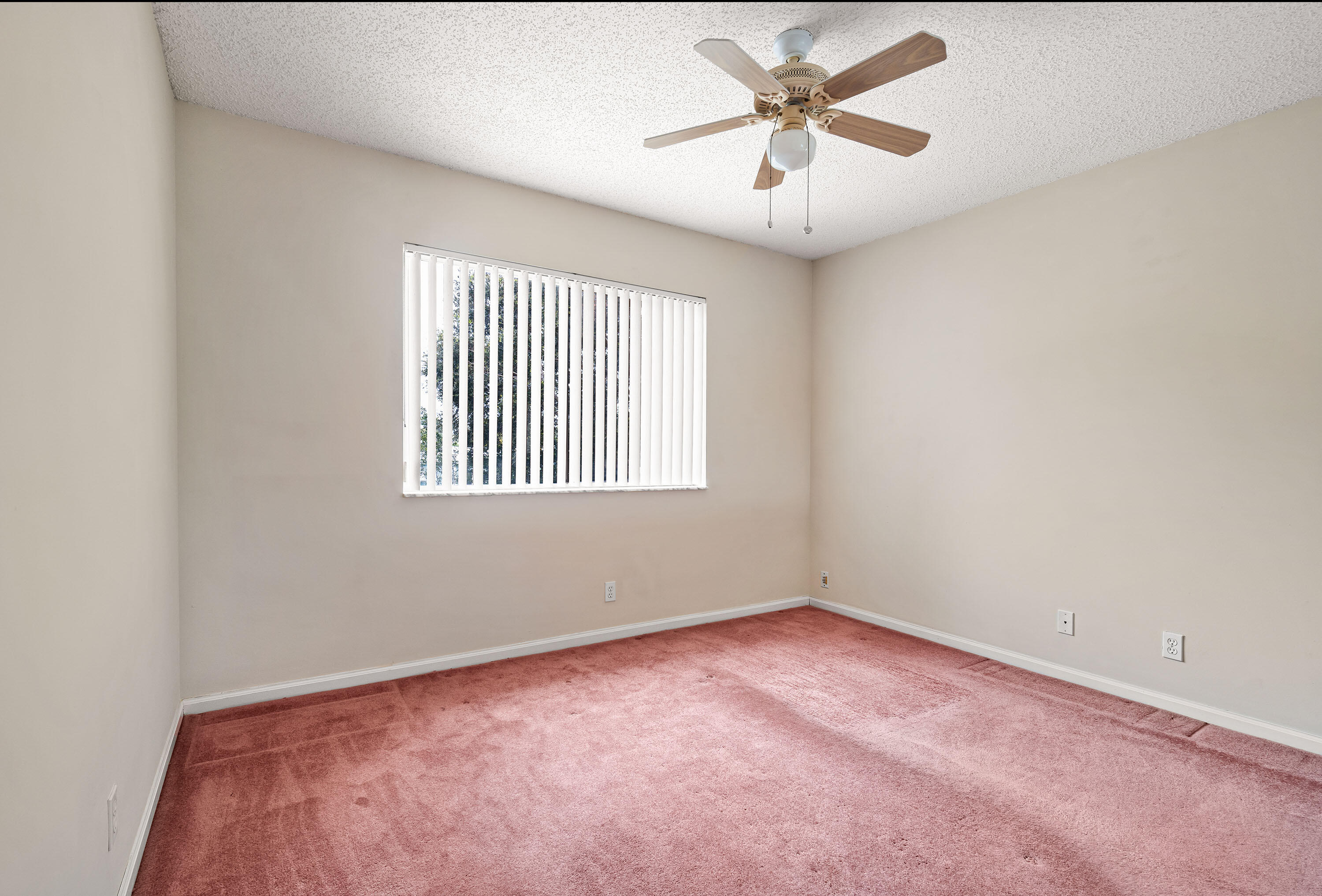 1104 Rialto Drive Boynton Beach, FL 33436 - Photo 15 of 50 an empty room with a window and a fan