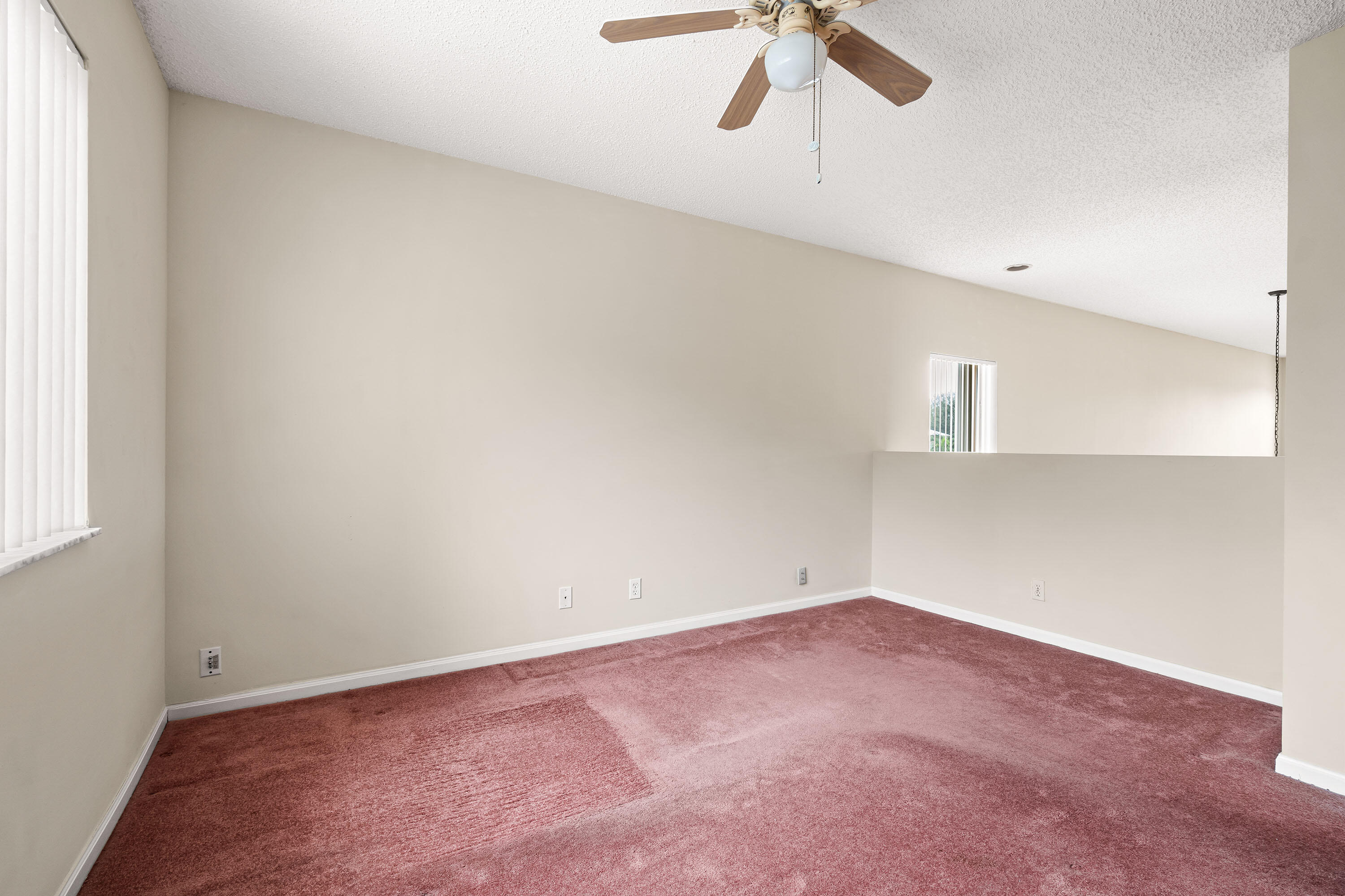 1104 Rialto Drive Boynton Beach, FL 33436 - Photo 16 of 50 an empty room with a ceiling fan and window