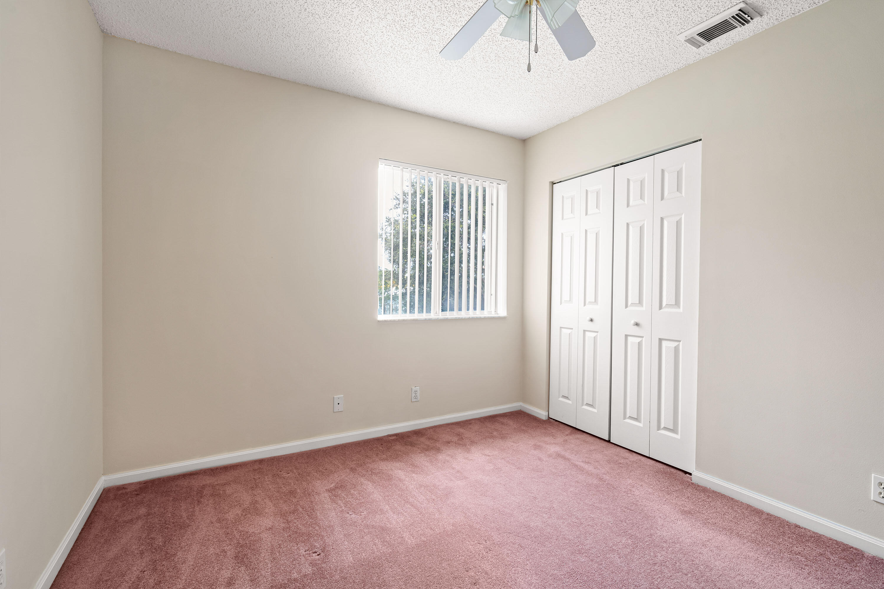 1104 Rialto Drive Boynton Beach, FL 33436 - Photo 18 of 50 an empty room with windows and closet