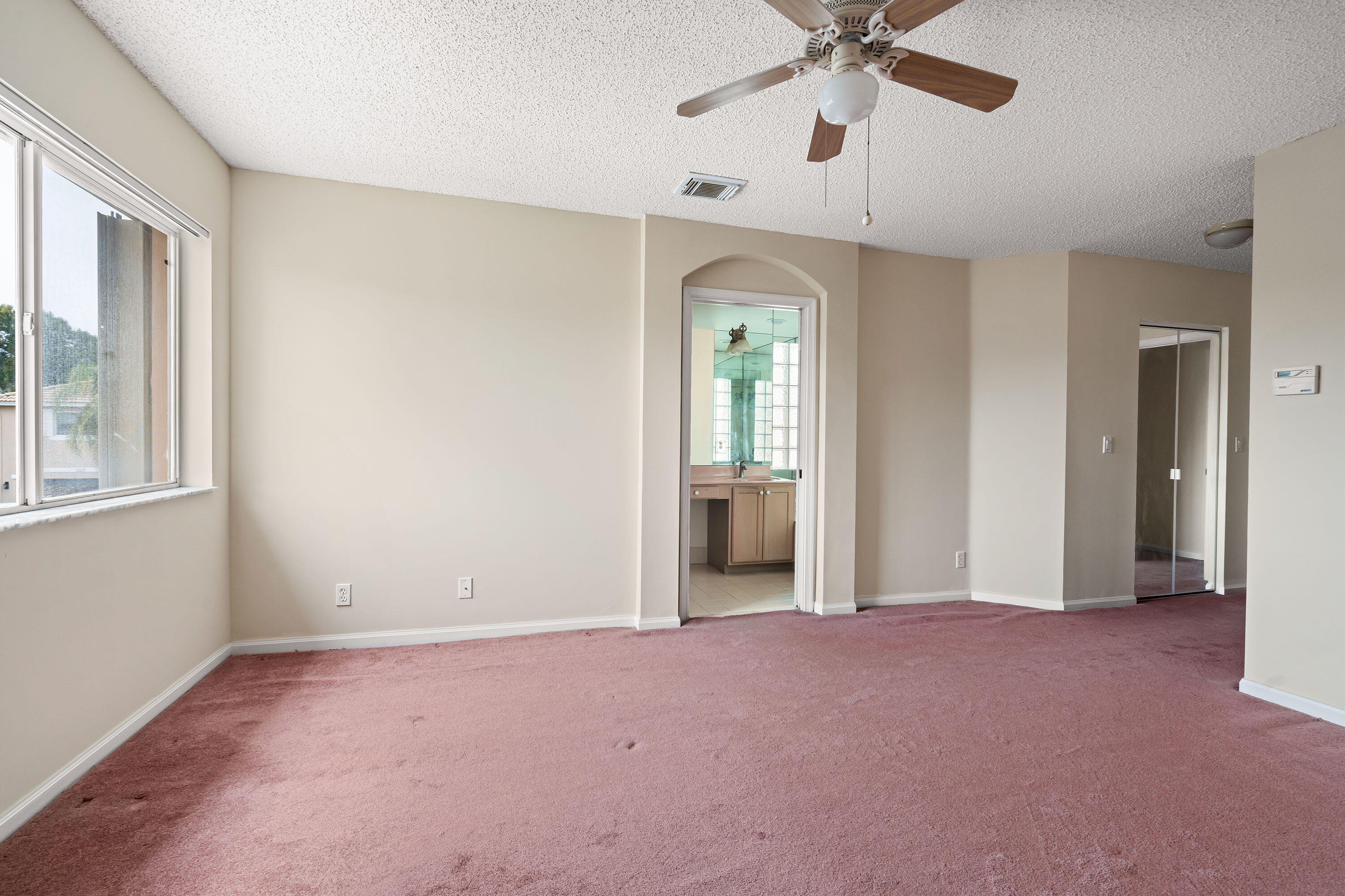1104 Rialto Drive Boynton Beach, FL 33436 - Photo 22 of 50 a view of a room with a ceiling fan and a window