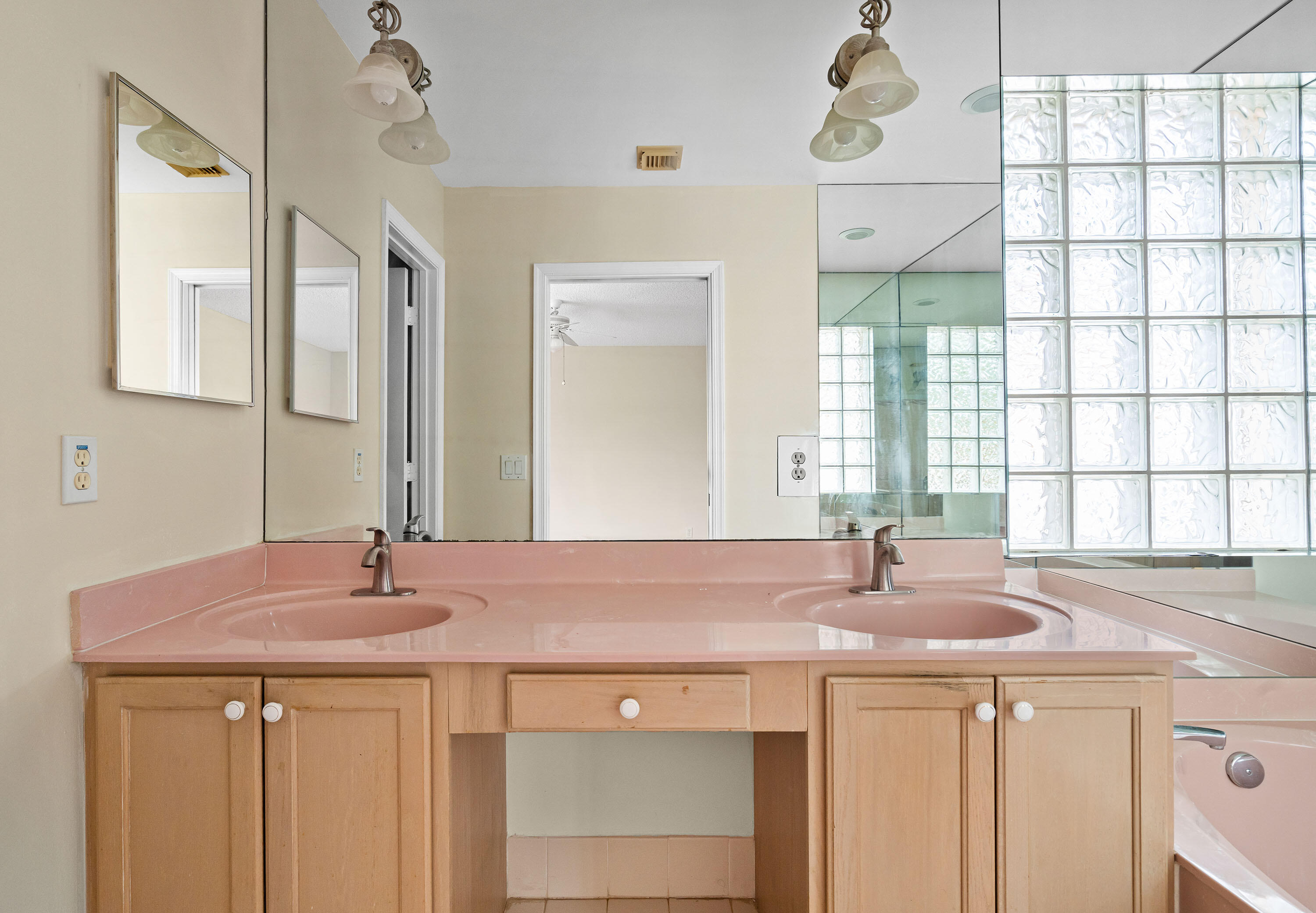 1104 Rialto Drive Boynton Beach, FL 33436 - Photo 23 of 50 a bathroom with a sink and a large mirror