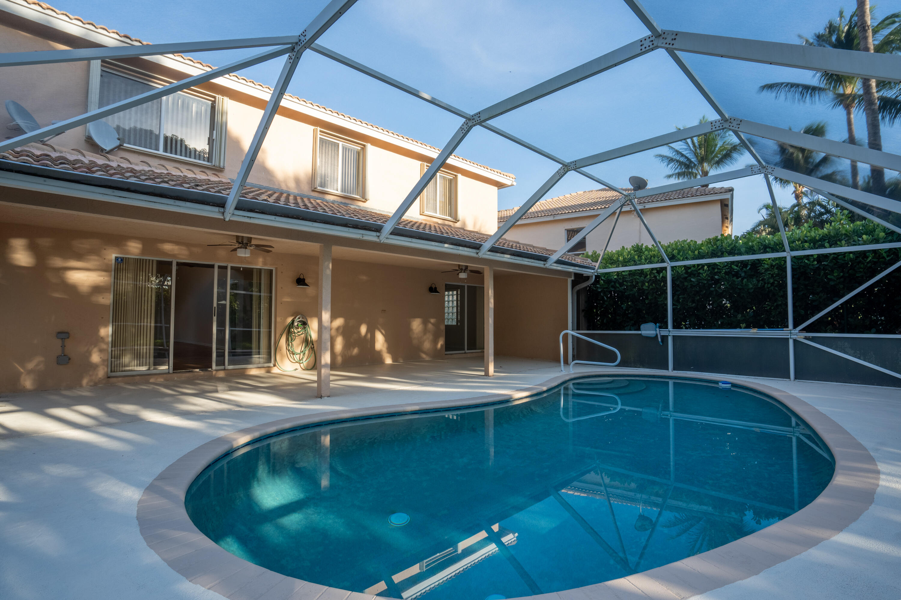 1104 Rialto Drive Boynton Beach, FL 33436 - Photo 30 of 50 a view of a swimming pool with a patio